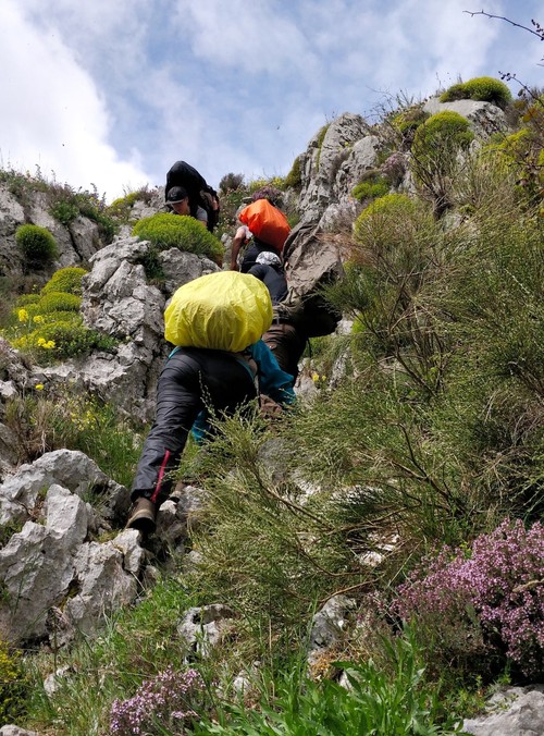 Rock climbing with backpacks on