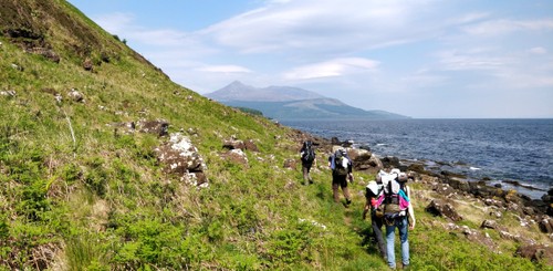 Walking along the shore with Goatfell in the back