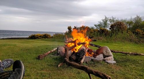 Warming up at the campfire